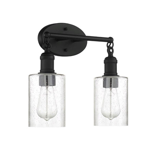 Sunset Lighting F6872-31 Clyde Vanity, Steel Round Glass Clear Seedy Matte Black Finish