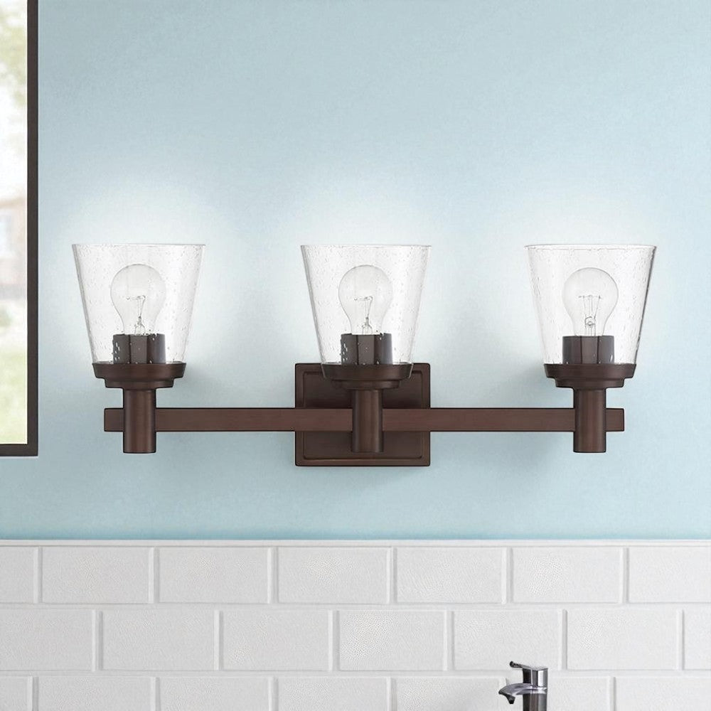 Sunset Lighting Riella 3-Light MB Vanity w/ Clear Seeded Glass Provincial Bronze F24103-64