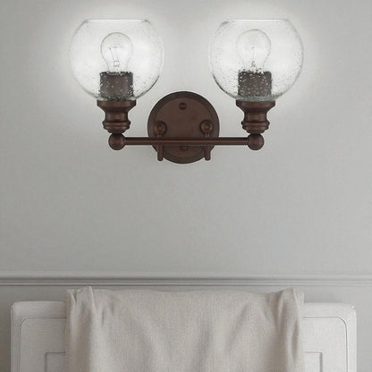 Sunset Lighting Oriana 2-Light Mb Vanity Clear Seeded Glass Provincial Bronze F29012-64